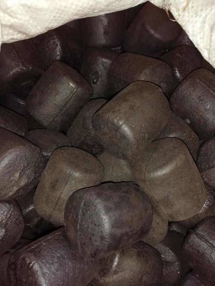 Large cast grinding cylpebs showing end faces and surfaces