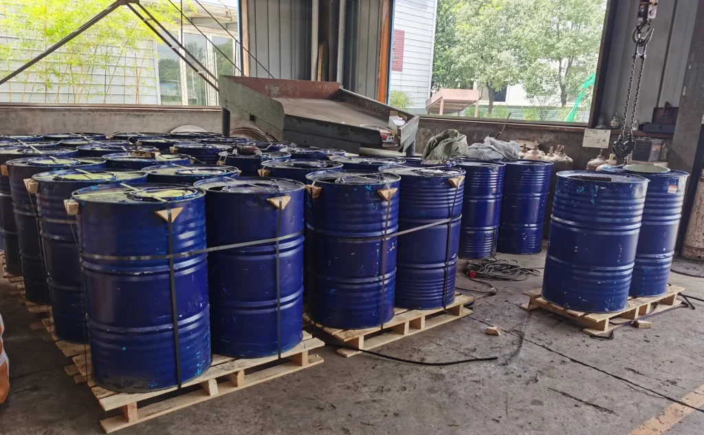 Steel drums on pallets prepared for grinding media shipment